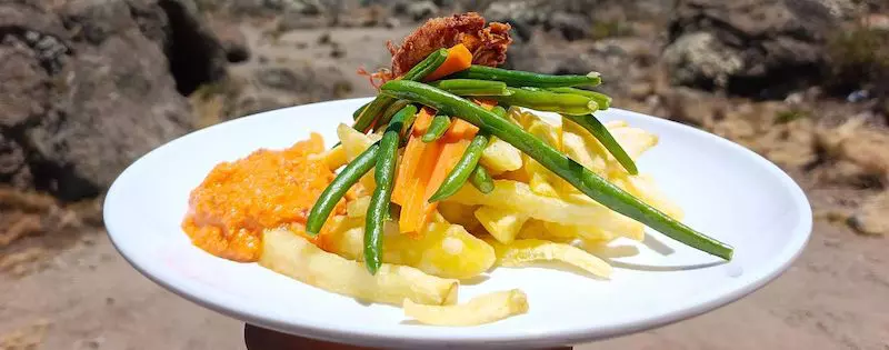 TK takes cuisine very seriously, to encourage climbers' appetites at high altitude on Kilimanjaro